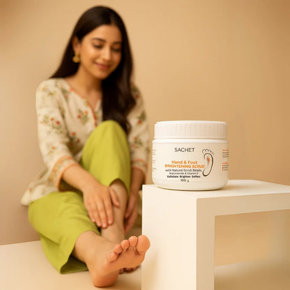 Woman sitting next to a jar of 'SACHET' foot scrub on a beige background