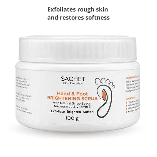 SACHET Hand & Foot Brightening Scrub jar with orange, aloe vera, and marigold flower on an orange background