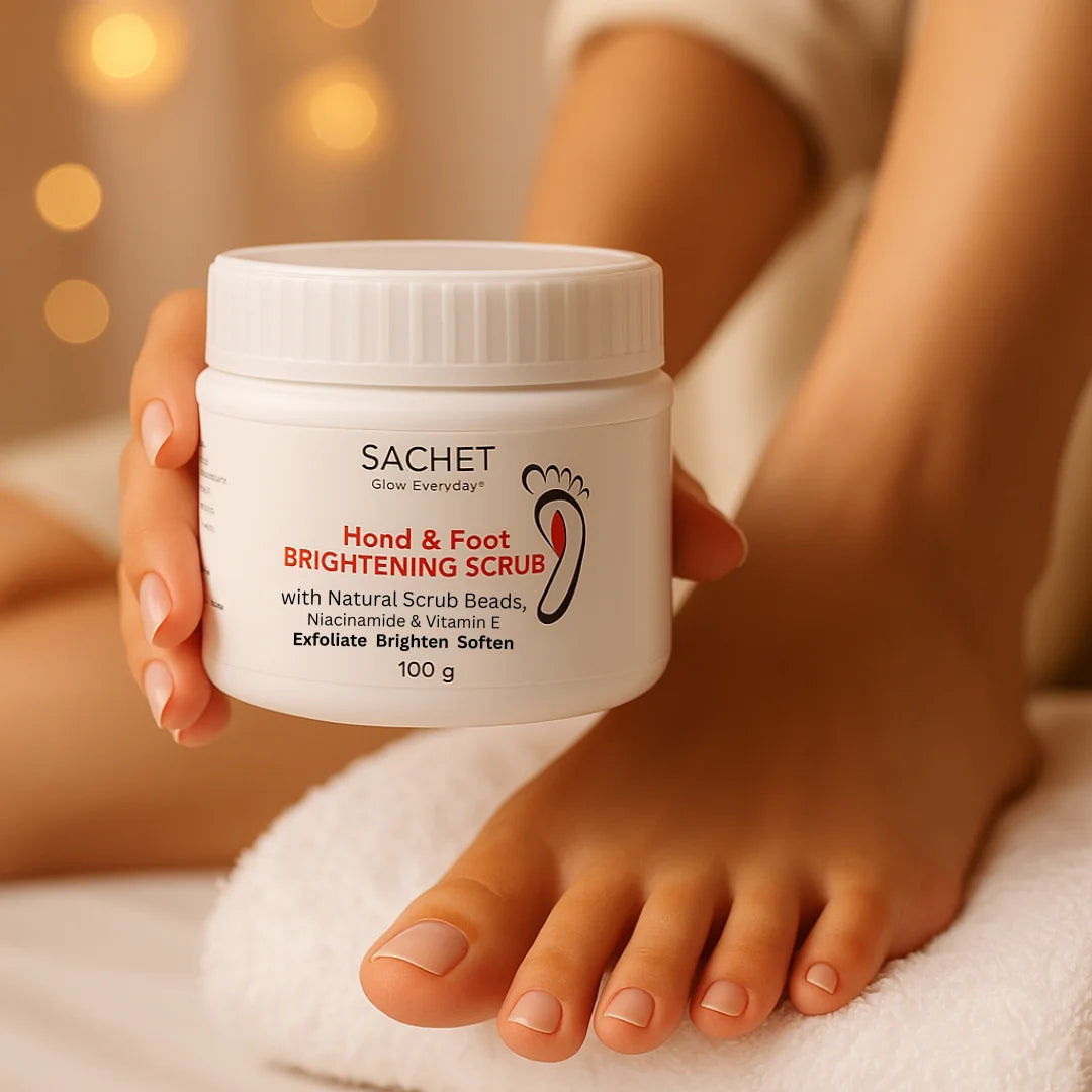 Person holding a jar of SACHET Hand & Foot Brightening Scrub with blurred lights in the background