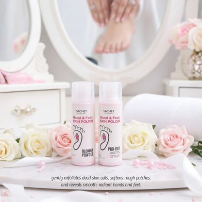Two bottles of 'Hand & Foot Skin Polish' by SACHET on a decorative surface with flowers and a mirror in the background.