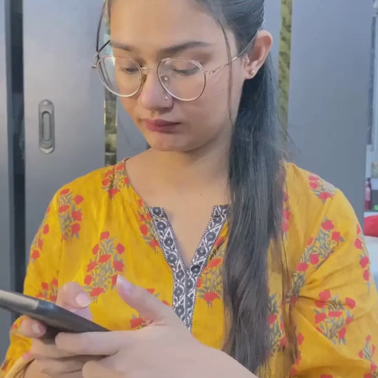 Pakistani woman applying Glow Boost Moisturizer Sunscreen SPF 65