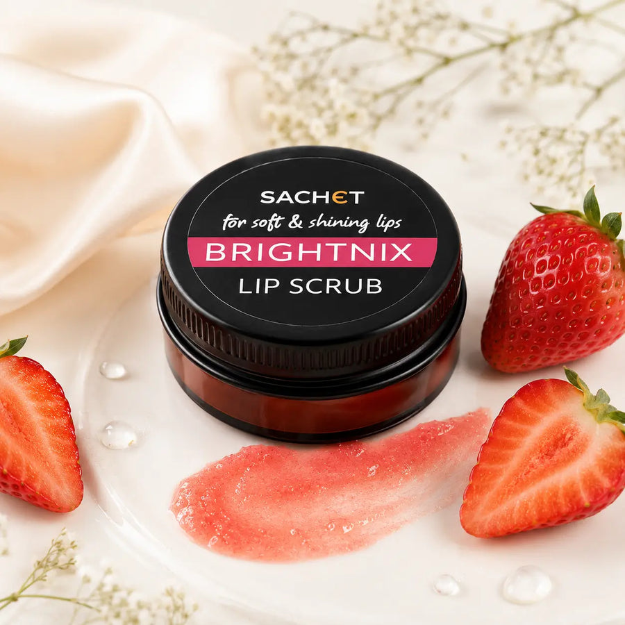 Woman applying lip scrub with Sachet Brightnix lip scrub packaging in the corner.