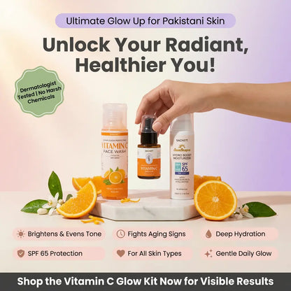Vitamin C skincare products with oranges and a hand holding a bottle on a light background