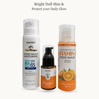Vitamin C skincare kit with bottles and oranges on a beige background