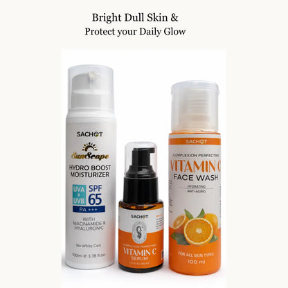 Vitamin C skincare kit with bottles and oranges on a beige background